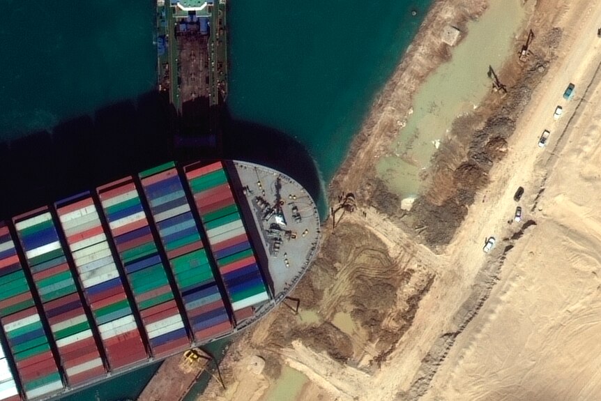 A satellite image showing the bow of the ship stuck in the banks of the canal.