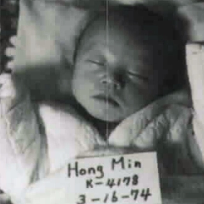 A black and white photo of a baby 