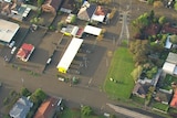 an aerial picture showing water over roads and in yards.