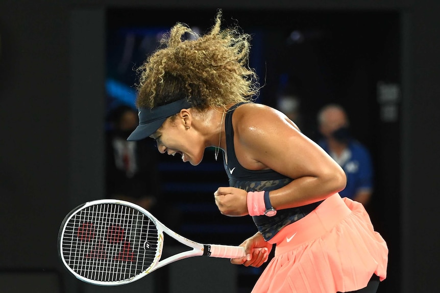 Naomi Osaka of Japan celebrates winning a point.