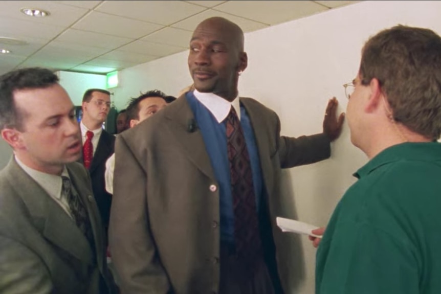 Michael Jordan looks askance after being asked for an autograph.