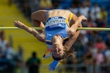 Nicola Olyslagers leaps backwards over a bar