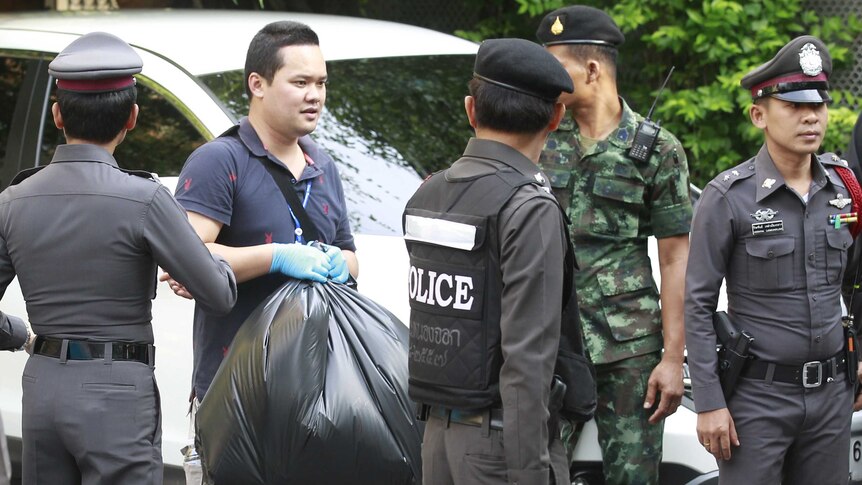 Thai Royal Police officials remove evidence