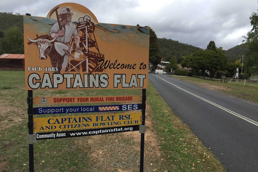 A sign reading "welcome to Captains Flat".