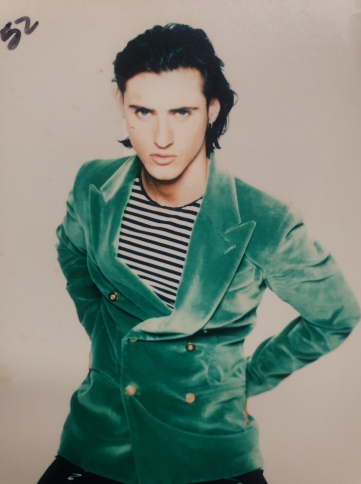 Daniel Taunton the model - sporting a green jacket and striped top.