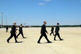 Barack Obama walks with Secret Service agents