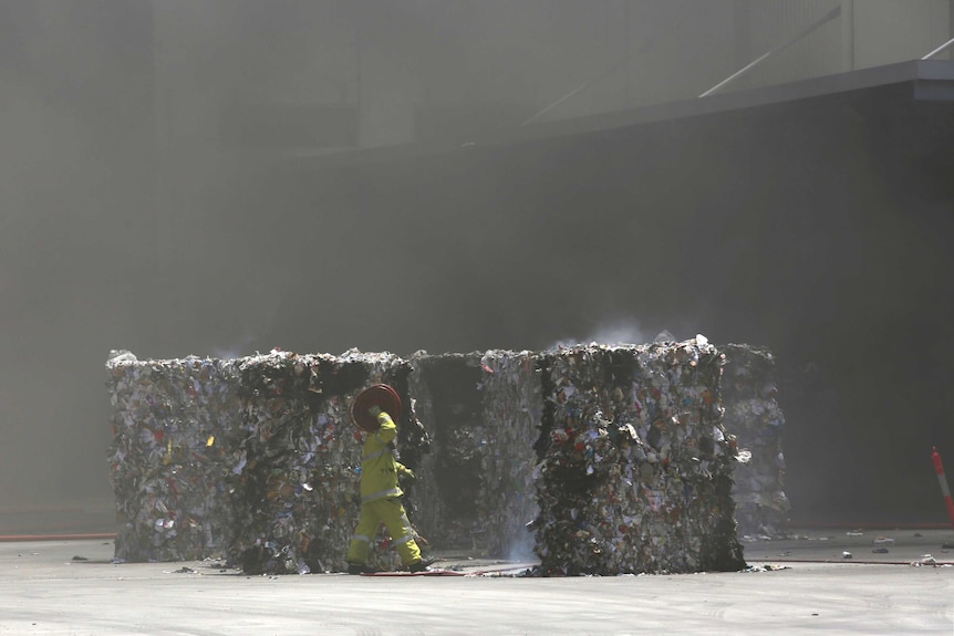 Smouldering pallets in front of a South Guildford factory.