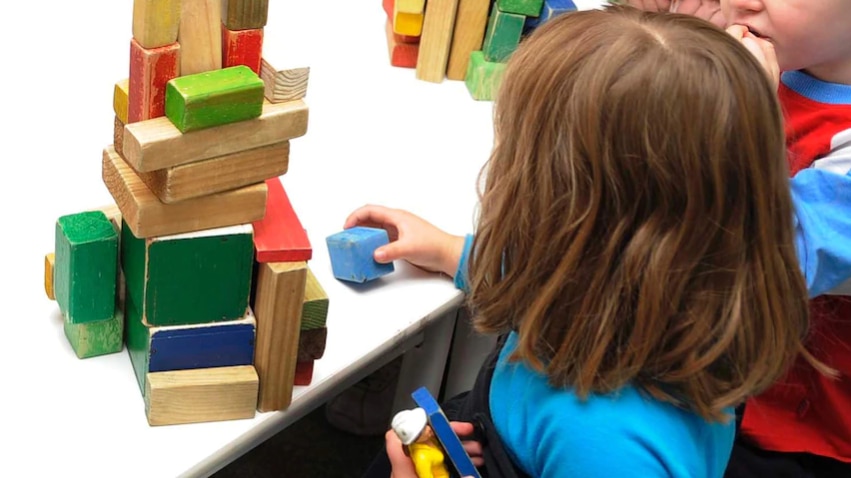 The back of a child playing.