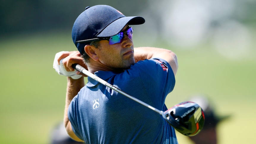 Australia's Adam Scott completes his swing as he looks down the fairway after his ball during a big tournament.