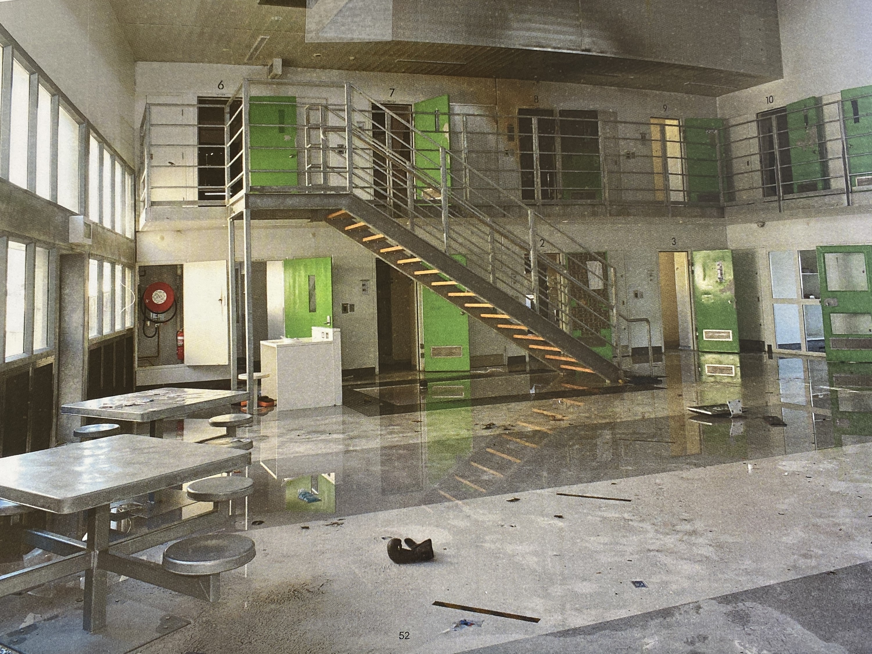 Damage from a fire in a prison common space.