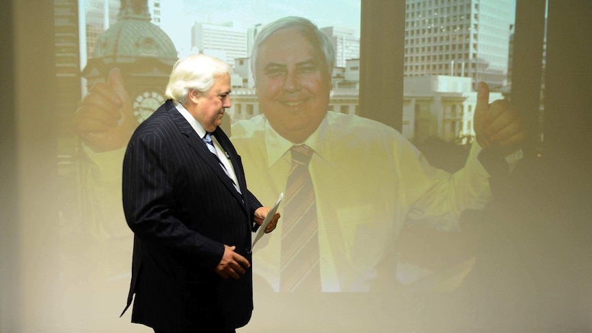 Clive Palmer arrives for a press conference in Brisbane