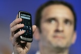 Google's VP for product management holds up the Nexus One smartphone