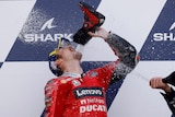 MotoGP rider celebrates winning by drinking out of his shoe.