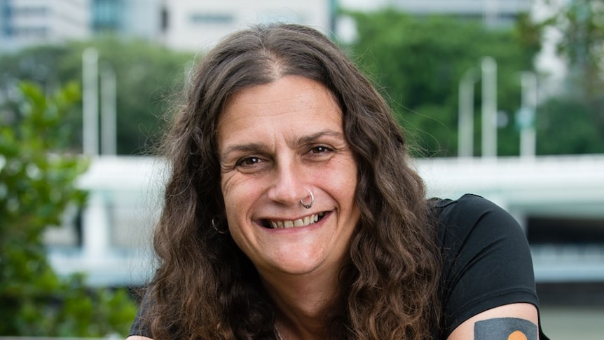 Indigenous author Claire G Coleman smiles for a photo.