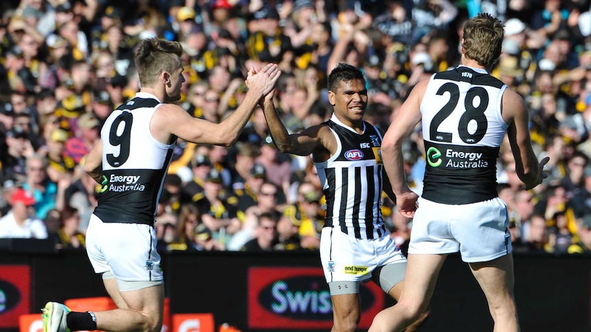 Port Adelaide's Jake Neade celebrates a goal with Robbie Gray against Richmond at Adelaide Oval.