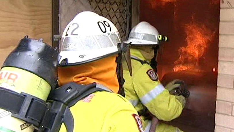 Two DFES officers enter house fire