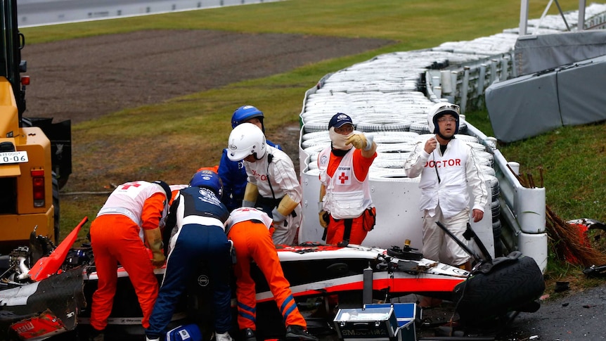 F1 driver Jules Bianchi receives urgent medical attention after crash in 2014 Japanese grand prix.