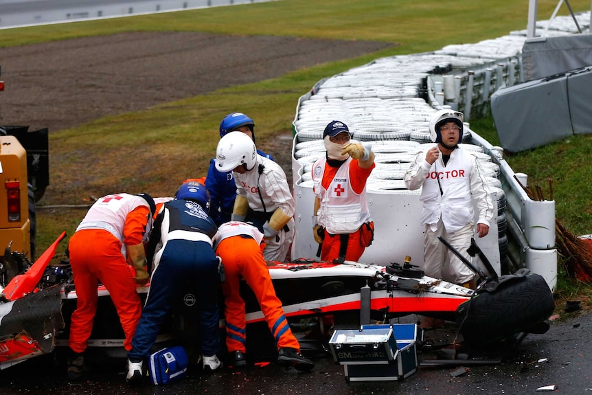 F1 driver Jules Bianchi receives urgent medical attention after crash in 2014 Japanese grand prix.