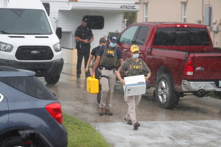 FBI agents are seen taking away boxes of evidence from the home of Brian Laundrie, Gabby Petito's fiance.