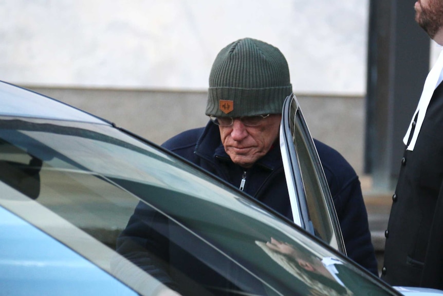 David Eastman (in beanie) gets into a car outside the ACT Supreme Court.