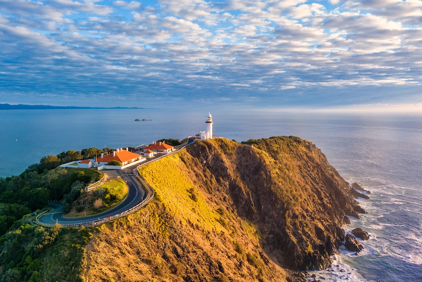 Aerial shot of Byron Bay lighthouse on peninsula