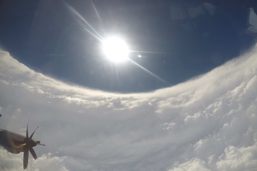 The sun and blue sky can be seen surrounded by white cloud.