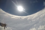 The sun and blue sky can be seen surrounded by white cloud.