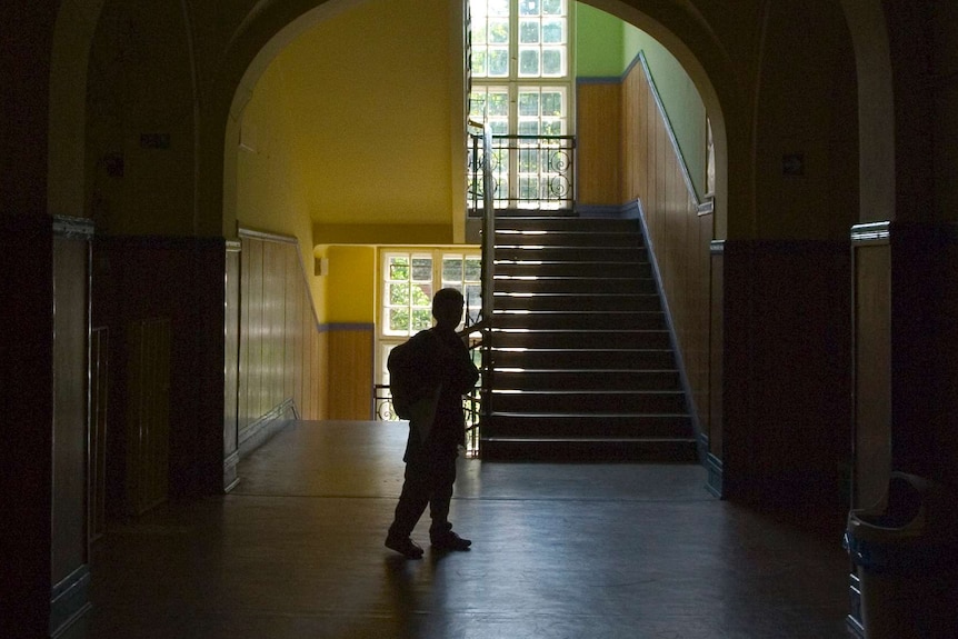 darkened hallway with child visible.