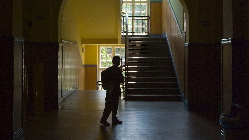 darkened hallway with child visible.