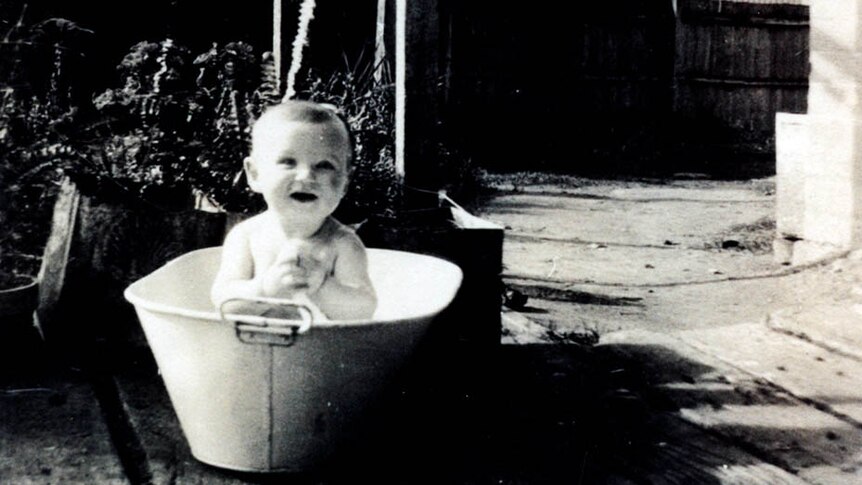 Baby Bob Hawke in a tin bath in the backyard of his Bordertown home.