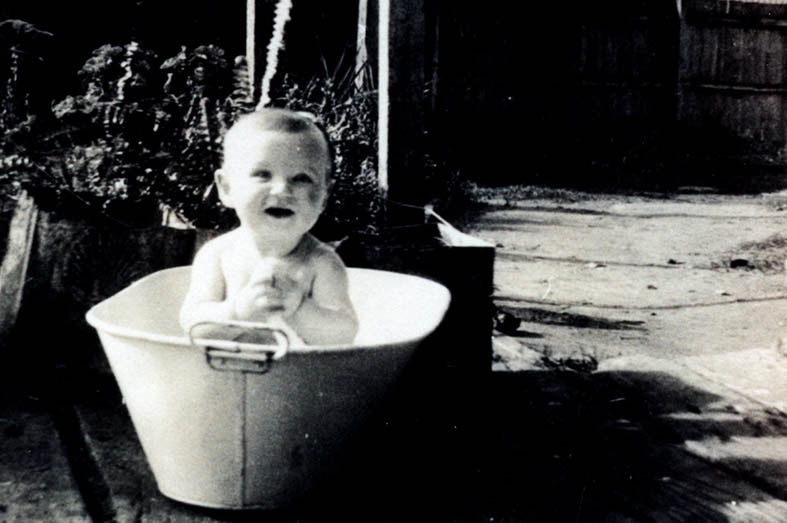 Baby Bob Hawke in a tin bath in the backyard of his Bordertown home.