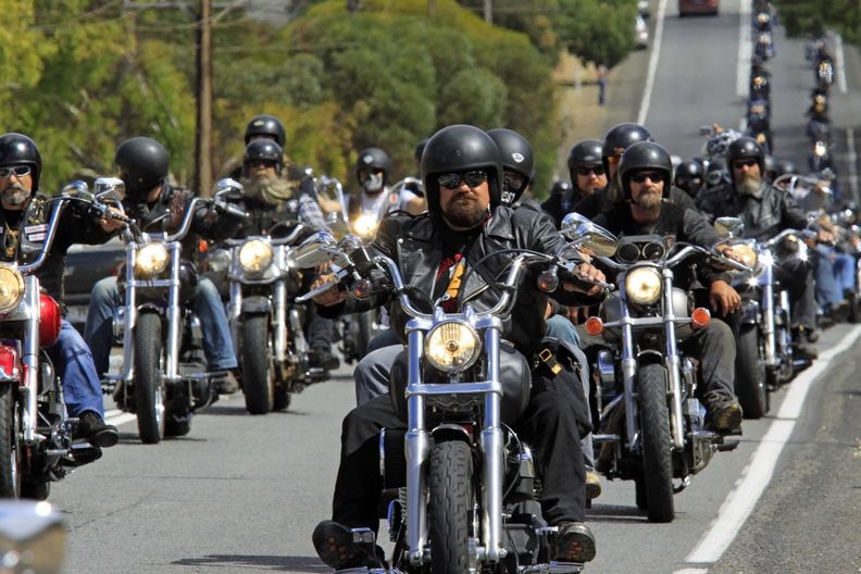 Members of the Gypsy Jokers bikie club and associated riders at the beginning of a Jokers wild poker run in Gawler.