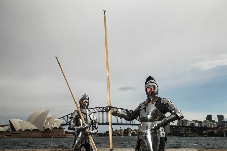 Jousters pose in front of the Opera House