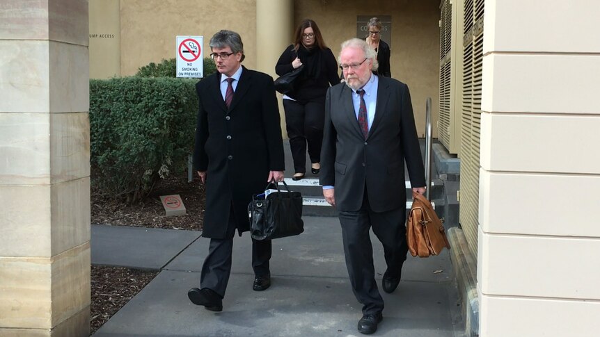 Dr Michael Metz walks from the coroner's court