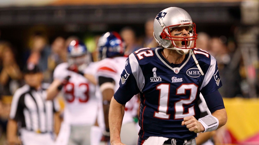 New England Patriots quarterback Tom Brady shouts after throwing a touchdown pass