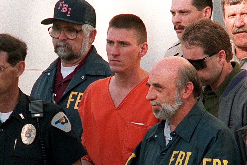 Timothy McVeigh, centre, is led from the Noble County Courthouse in Perry, Oklahoma, by FBI agents