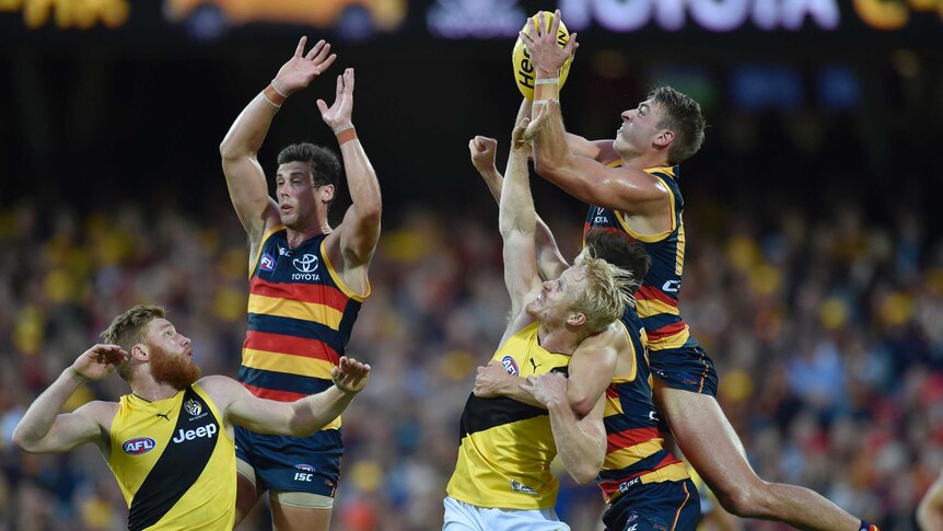 Daniel Talia of the Crows takes a mark against Richmond at Adelaide Oval.