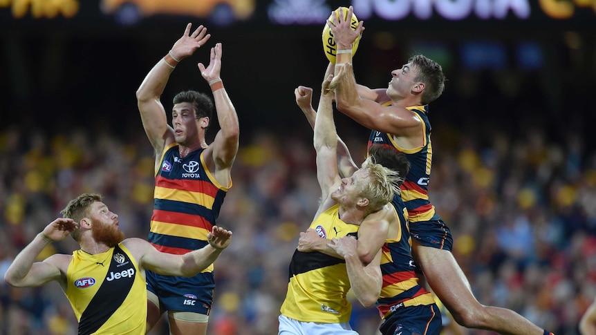 Crows and Richmond players leap for the ball in their round six game.