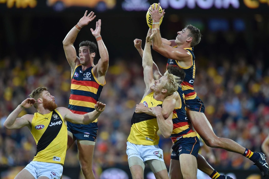 Crows and Richmond players leap for the ball in their round six game.