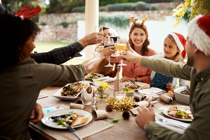 Cropped shot of a family making a toast on Christmas day