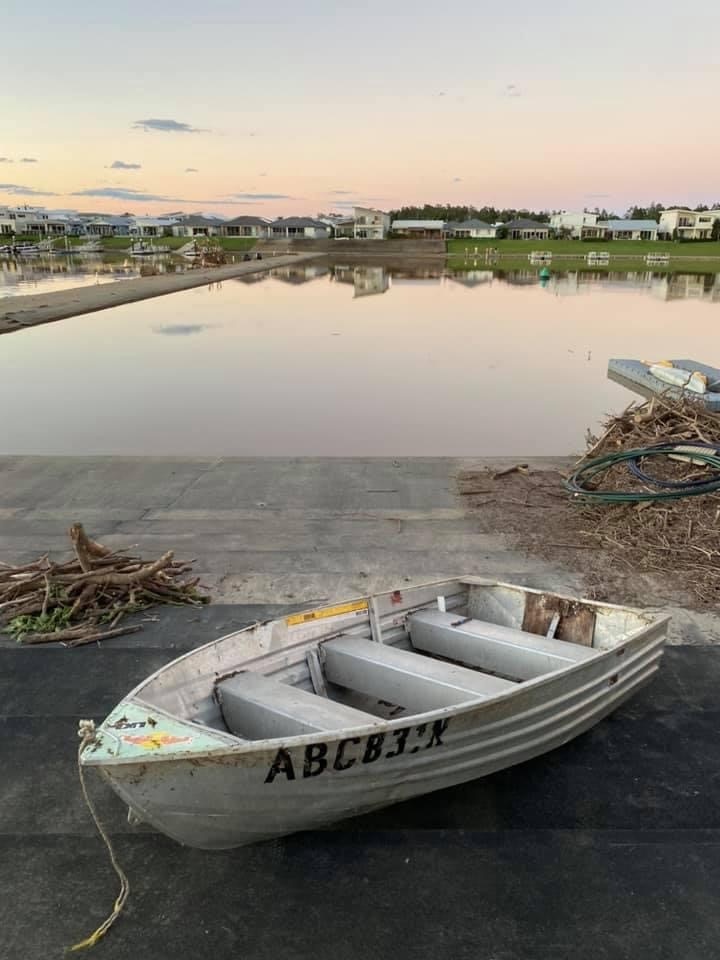 A tinny found washed up on the side of a waterway