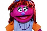 A photo of Sesame Street's new character Lily, who is being used to discuss issues such as poverty