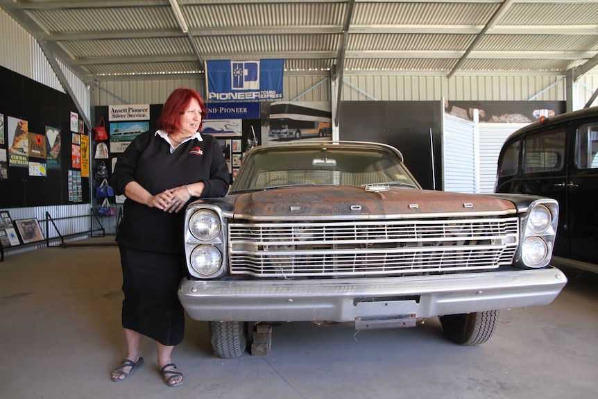 Friend Liz Martin with one of Graeme Phillips' cars inside the soon to be named Graeme Phillips Pavilion