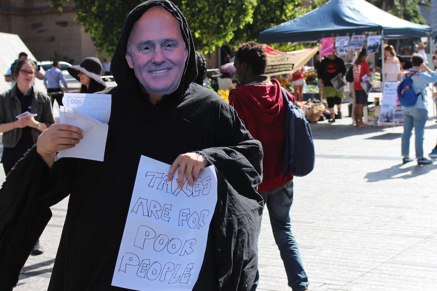 A person dressed as Malcolm Turnbull as a grave robber