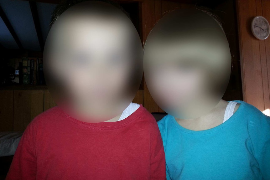 Blurred faces of two children