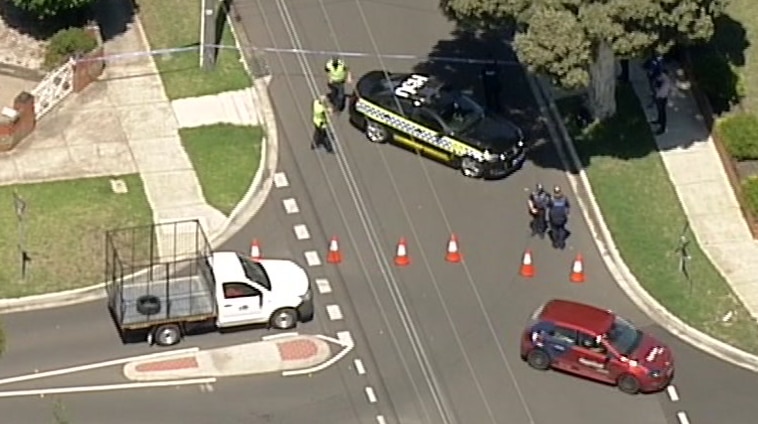 An aerial shot of police blocking off a road in Deer Park.