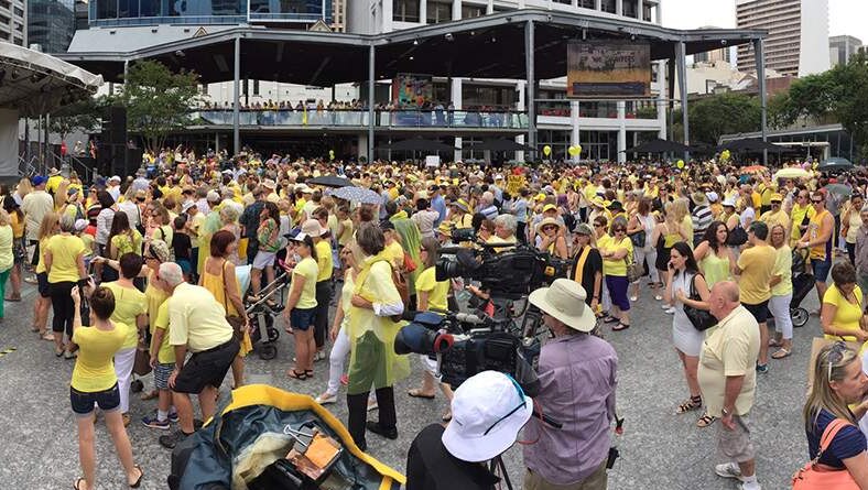 Crowd dressed in yellow gather at King George Square in Brisbane's CBD for rally to support Allison Baden-Clay