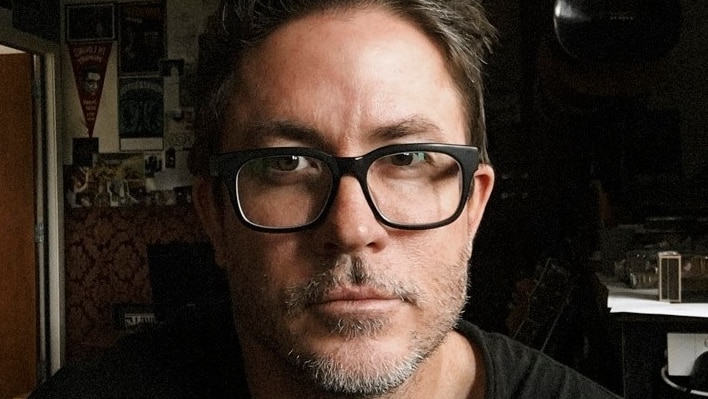 A man wearing glasses.