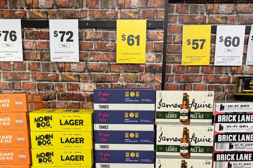 beer cartons next to eachother in different colours and brands