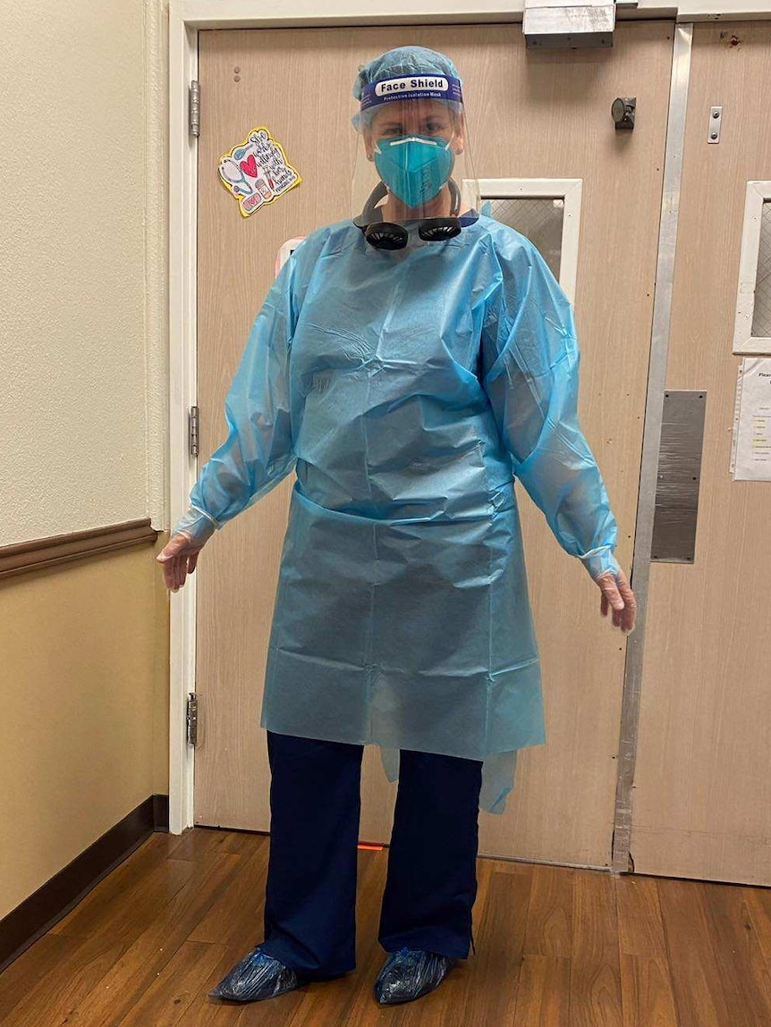 A frontline worker in full PPE gears inside a hospital.